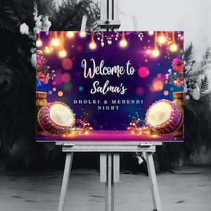 May include: Welcome to Salma's Dholki & Mehendi Night sign with a purple background, colorful lights, and two drums.
