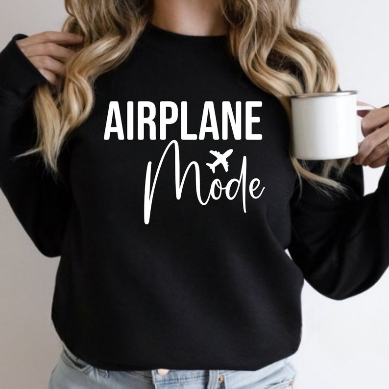 May include: Black sweatshirt with white text that reads "AIRPLANE Mode" with a small airplane icon.