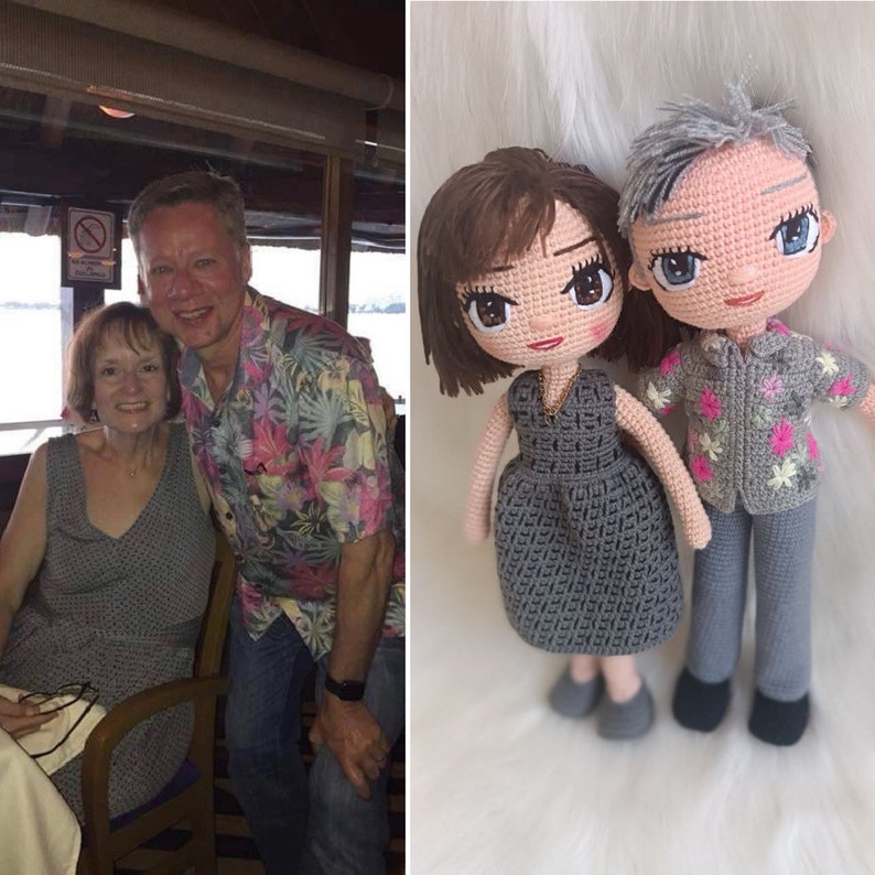 May include: A crocheted doll couple, a woman with brown hair wearing a gray dress and a man with gray hair wearing a gray shirt and pants with floral accents.