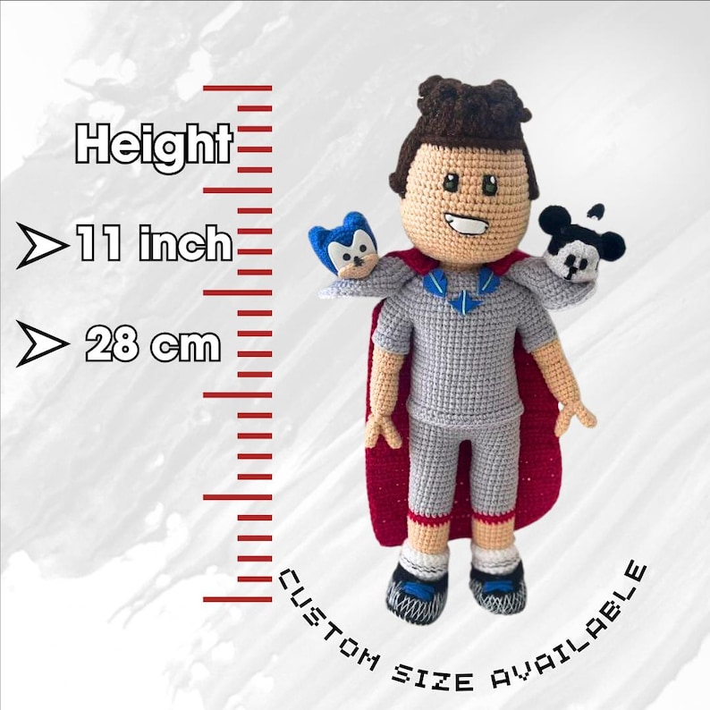 May include: Crocheted plush toy of a person wearing a red cape and holding two smaller plush toys. The person is 11 inches tall or 28 cm. Custom sizes are available.