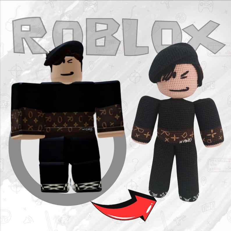 May include: A crocheted Roblox avatar doll wearing a black beret, black shirt with a brown and gold pattern, and black pants. The doll is standing next to a digital illustration of a Roblox avatar wearing the same outfit.