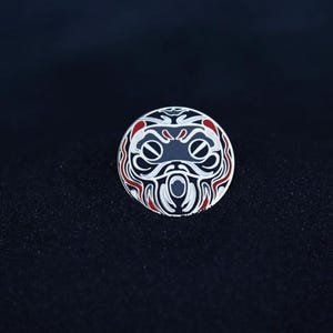 Black defence pin - An enamel pin collection inspired by Japanese culture, specifically the famous Daruma Dolls