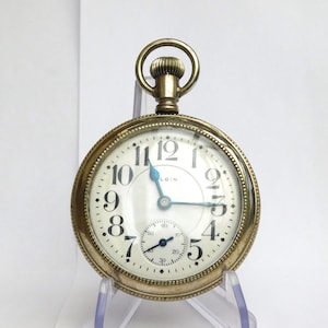 Elgin 19j B W Raymond railroad watch in display case. Runs well.
