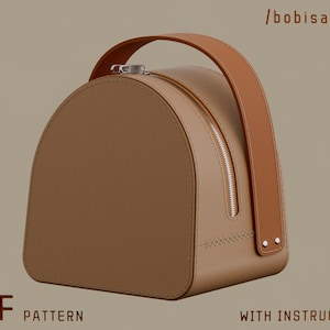 May include: A tan-colored, semi-circular handbag with a brown handle and zipper closure. The bag has a stitched base and the text "PDF PATTERN WITH INSTRUCTIONS" is displayed.