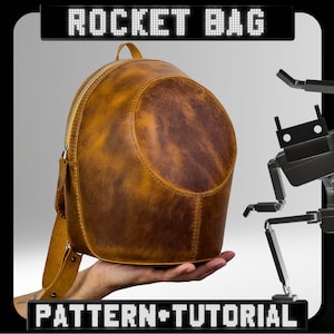 May include: A brown leather backpack with a round shape and a zipper closure. The backpack is being held in a person's hand. The text "ROCKET BAG PATTERN + TUTORIAL" is displayed on a black and white background.
