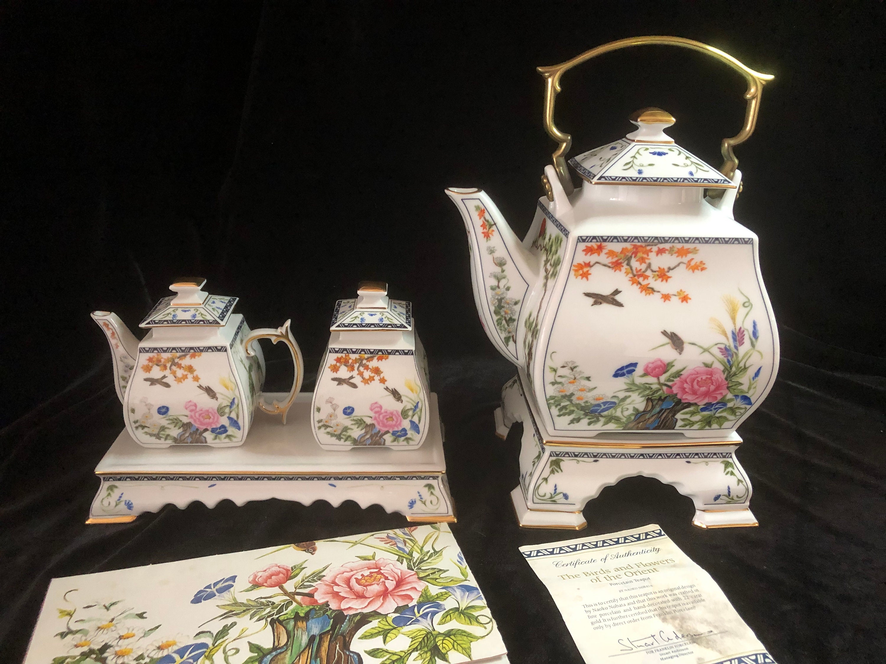 Porcelain Tea Set With Tea Pot, Creamer and Sugar Bowl. the