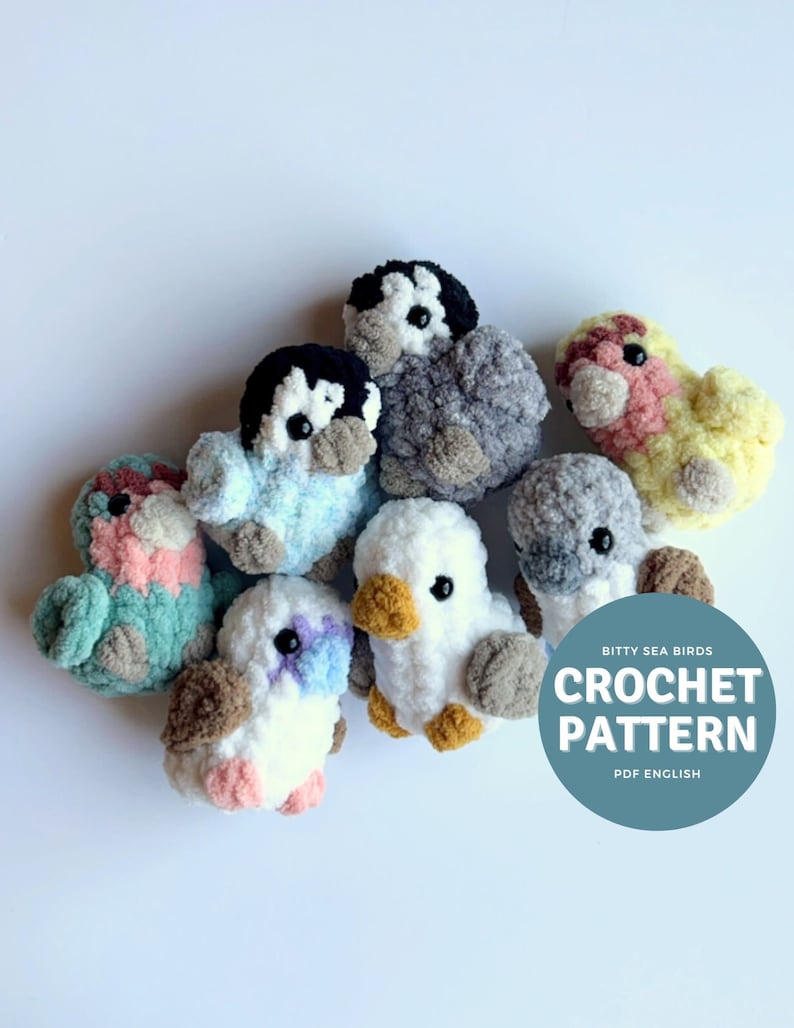May include: A collection of crocheted seabird amigurumi toys in various colors, including pink, yellow, blue, white, and gray. The toys are arranged on a white background with a blue circle that says "Bitty Sea Birds Crochet Pattern PDF English".