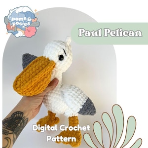 May include: A crocheted pelican toy named "Paul Pelican" with a white body, gray wings, and a yellow beak and feet. The image also includes the text "Digital Crochet Pattern" and the logo "poms & posies".