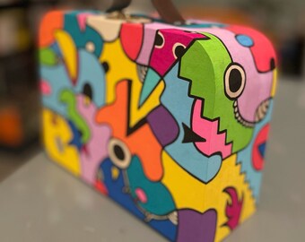 Small colorful wooden suitcase at Posca