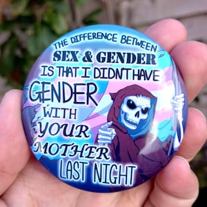 May include: A circular badge with a blue and purple gradient design. It features a cartoon grim reaper holding a scythe, with the text: "THE DIFFERENCE BETWEEN SEX & GENDER IS THAT I DIDN'T HAVE GENDER WITH YOUR MOTHER LAST NIGHT."