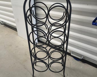 Botellero antiguo de hierro forjado de Arthur Umanoff