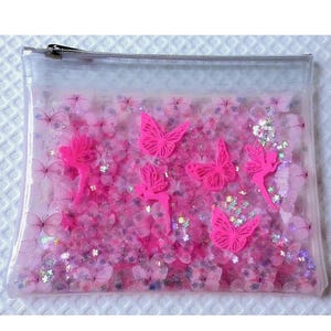 ¡OFERTA! Neceser de maquillaje con purpurina líquida. Estuche de maquillaje con mariposas y hadas rosa neón y flotador de flores iridiscentes con brillo en vinilo estampado.