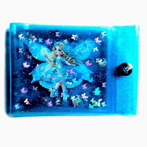 Liquid Glitter Jelly Elf Wallet. Multicoloured Flower Fairy + Holographic Butterfly Shimmer Float in Metallic Baby Blue Vinyl. LED Neon Case