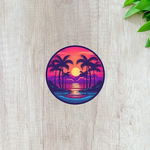 May include: A circular sticker featuring a sunset scene with palm trees, a beach, and a bright orange sun. The background is a gradient of pink, purple, and blue.