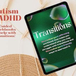 May include: A green digital tablet with a cover that says "Transitions: Neurodivergent-affirming workbook that helps you understand why you may struggle with transitions and Neurodivergent-friendly ways to approach it." The tablet is on a white surface with a straw-colored woven mat and dried grass.