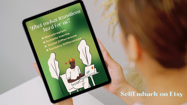 May include: A digital tablet displaying a green background with a cartoon illustration of a person sitting at a desk with a laptop. The text on the screen reads "What makes transitions hard for us?" with a list of bullet points: "Monotropism", "Autistic Inertia", "Social Differences", and "Sensory Differences".
