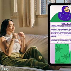 May include: A woman sits on a white sofa, holding a cup, with a tablet displaying text and illustrations. The tablet's screen shows the words "Goal Of This Section" and a graphic of a person in a hijab.