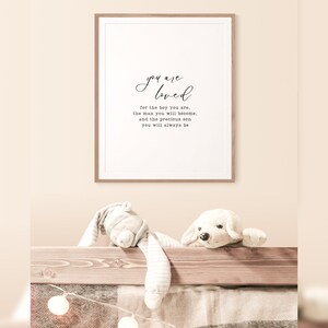Peut inclure: Une impression encadr&eacute;e avec un fond blanc et du texte noir qui dit "you are loved for the boy you are, the man you will become, and the precious son you will always be."