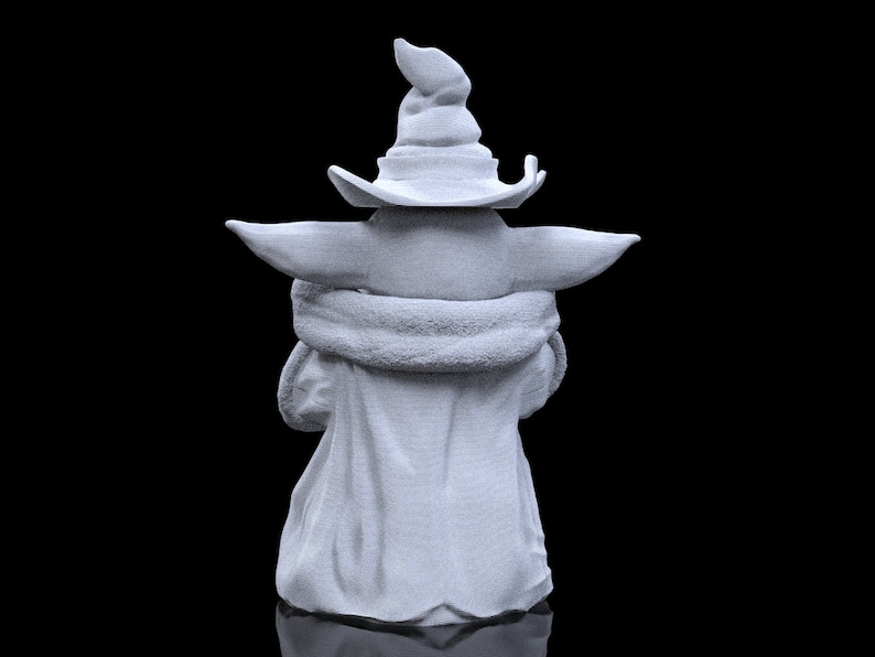 K&ouml;nnte beinhalten: Eine wei&szlig;e 3D-gedruckte Figur eines Charakters, der einen spitzen Hut tr&auml;gt. Der Charakter sitzt mit gekreuzten Armen und ist von der Kamera abgewandt.