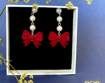 decorazioni natalizie con fiocco in velluto, fiocchi di velluto rosso