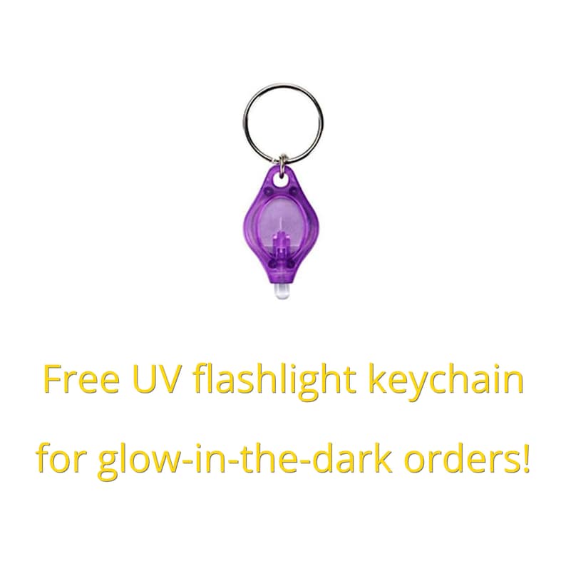 May include: A small, purple, keychain-sized UV flashlight with a silver key ring. Free UV flashlight keychain for glow-in-the-dark orders!