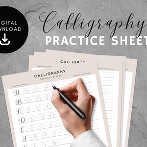 May include: Printable calligraphy practice sheets with a hand writing the letter 'B' on a sheet that says "Calligraphy Capital Letters".