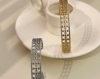Adjustable bangle bracelet in stainless steel polar star chiseled cross silver gold