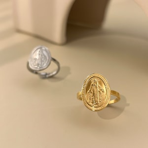 Adjustable oval stainless steel ring with chiseled Virgin Mary Madonna