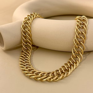 Stainless steel necklace in wide ribbed braided link chiseled silver gold