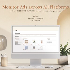 May include: A computer screen displaying a website for managing advertising campaigns. The website is titled "Advertising" and features sections for ad posts, ad spend transactions, and an ad calendar. The screen is on a desk with a lamp, a pencil holder, and a plant.