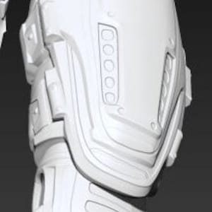 Może przedstawiać: Biały ochraniacz kolan z tworzywa sztucznego z fakturowaną powierzchnią i wieloma wypukłymi żebrami. Ochraniacz kolan jest przeznaczony do ochrony i wsparcia.