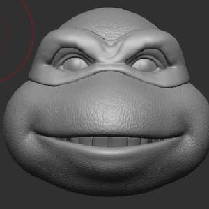 May include: A 3D model of a Teenage Mutant Ninja Turtle's head, rendered in grayscale. The turtle is smiling with its mouth open, showing teeth. The turtle's eyes are closed, and its mask is visible.