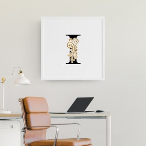 May include: A white framed print with a black letter I with gold floral embellishments.