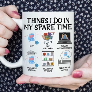 May include: White ceramic mug with a black and white illustration of things to do in your spare time, including knitting, buying yarn, researching knitting patterns, talking about knitting, rearranging yarn, and dreaming about knitting.