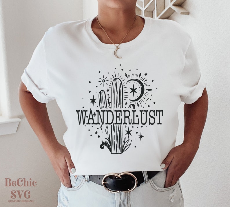 May include: White t-shirt with a black cactus and stars graphic and the text "WANDERLUST".