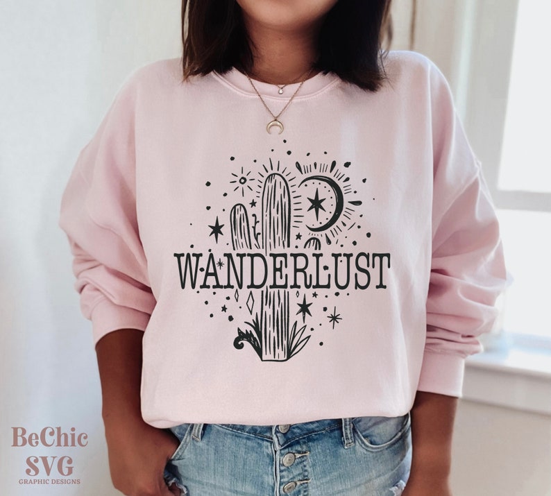 May include: A pink sweatshirt with a black cactus graphic and the text "WANDERLUST".