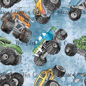 May include: A repeating pattern featuring cartoon monster trucks in various colours, including orange, green, blue, and yellow, with large black tyres. The background is blue. The design has a playful, cartoonish style.