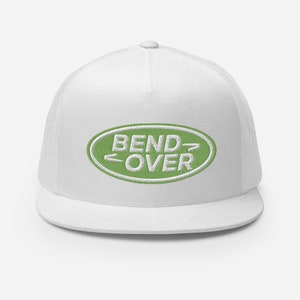 May include: White trucker hat with a green oval patch that says "BEND OVER" in white text.