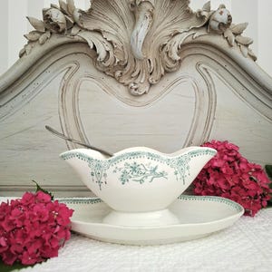 Antique sauceboat on ironstone earthenware frame