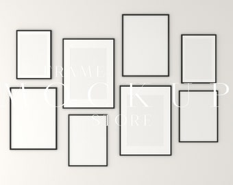 May include: A gallery wall mockup with six black picture frames of various sizes. The frames are arranged in a staggered pattern on a white wall.