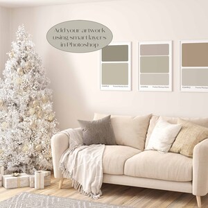 May include: A white Christmas tree with gold ornaments sits next to a beige couch with pillows and a throw blanket. Three framed artwork mockups are on the wall behind the couch. The text "Add your artwork using smart layers in Photoshop" is written on the wall.