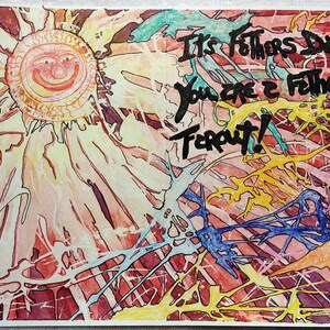May include: A colorful watercolor painting with a smiling sun and the text "It's Fathers Day. You are a Father. Far out!"