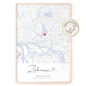 May include: A framed map print of Hamburg, Germany, featuring light blue streets and water bodies on a white background. A small red heart marks a location. Below the map, the text reads Zuhause, Familie Schuster, and coordinates.