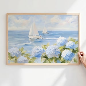 May include: A framed painting depicts a serene seascape with two sailboats on a blue ocean under a cloudy sky. The foreground features vibrant blue hydrangea flowers with green leaves, adding a touch of nature to the nautical scene.
