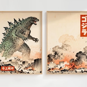 May include: Two framed art prints. One features a green Godzilla monster stomping through a city, with Japanese text. The other print shows a city engulfed in flames, with Japanese text in a red box. Both prints have a vintage aesthetic.