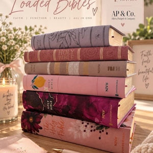 May include: A stack of six Bibles with varied covers including floral, solid, and abstract patterns, alongside a small pink notebook with the text PRAY STUDY PLAN GROW REPEAT and a pen with the text MORE OF HIM, set against a branded background.