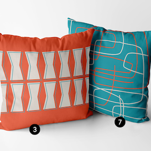 May include: Two decorative throw pillows with geometric patterns. One pillow is orange with a white and teal geometric pattern. The other pillow is teal with a white and orange geometric pattern.