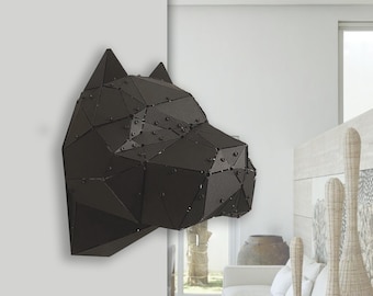 May include: A black geometric metal wall sculpture of a dog's head. The sculpture is mounted on a white wall and features a polygonal design with visible rivets. The dog's head is in profile, showcasing its ears and snout.