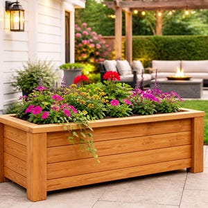 DIY raised planter box woodworking plans featuring a modern outdoor wooden planter with sturdy legs and clean horizontal slat design. Perfect for garden, patio, or backyard projects, this build showcases a durable and stylish raised garden bed ideal for flowers, herbs, or vegetables. Step-by-step DIY woodworking plans suitable for beginners and intermediate woodworkers looking to create a functional and decorative planter box.