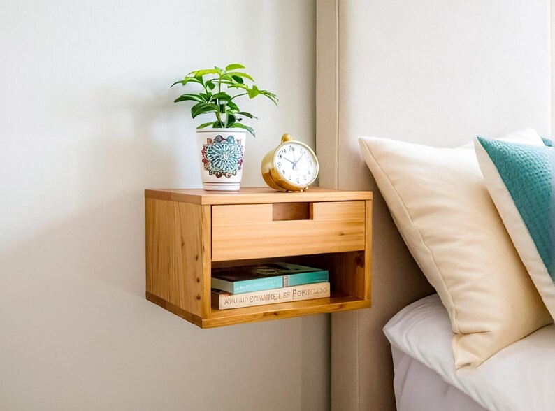 Here is a floating nightstand made of wood placed on the wall in the bedroom. It can also be used in the living room, living room.

Overall Dimensions:
H 10.75 inch, L 16.5 inch, D 14 inch